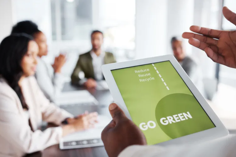 What Is Sustainability Content Marketing? Definition & Things to Know 5 Go green, business meeting and people on tablet screen for sustainable project, eco friendly investment and growth. Paperless or vegan presentation, sustainability and man speaker speaking to clients