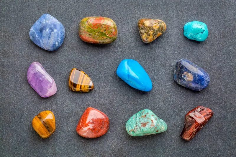 Colorful gemstones on slate stone