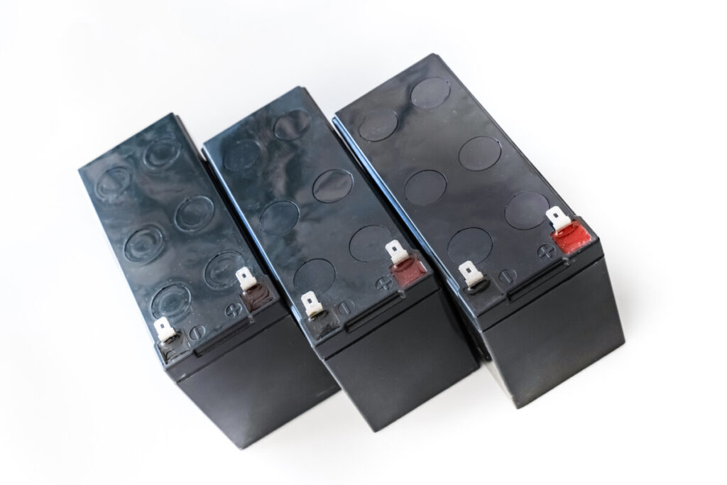 Solar Lead-Acid Batteries: Types, Sizing, Maintenance, and Safety 2 Three sealed lead-acid batteries with positive and negative terminals visible