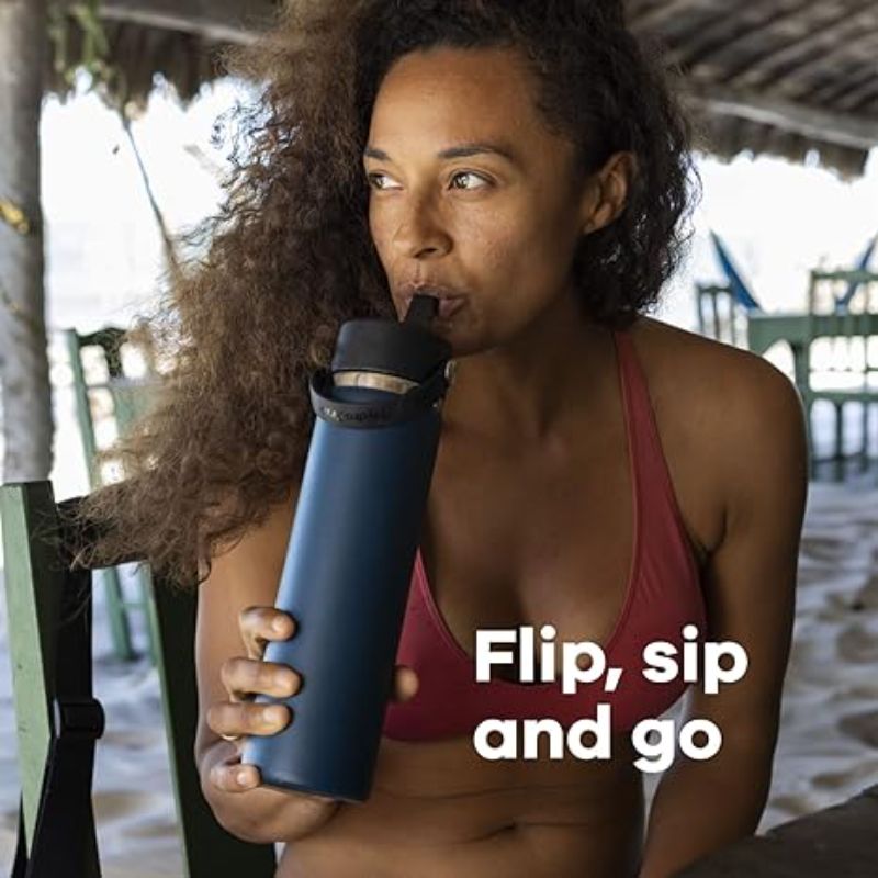 Woman sipping drink from a Hydro Flask tumbler