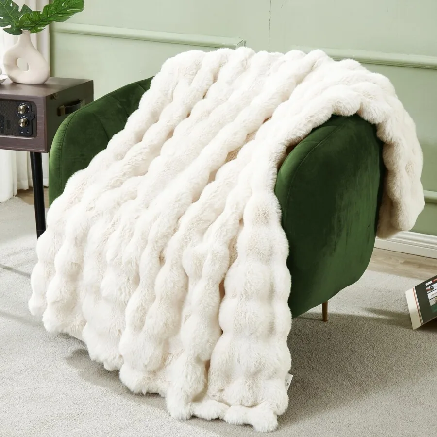 Angora and Faux Fur: Is It Bad for the Environment? 10 Faux fur blanket on a green accent chair