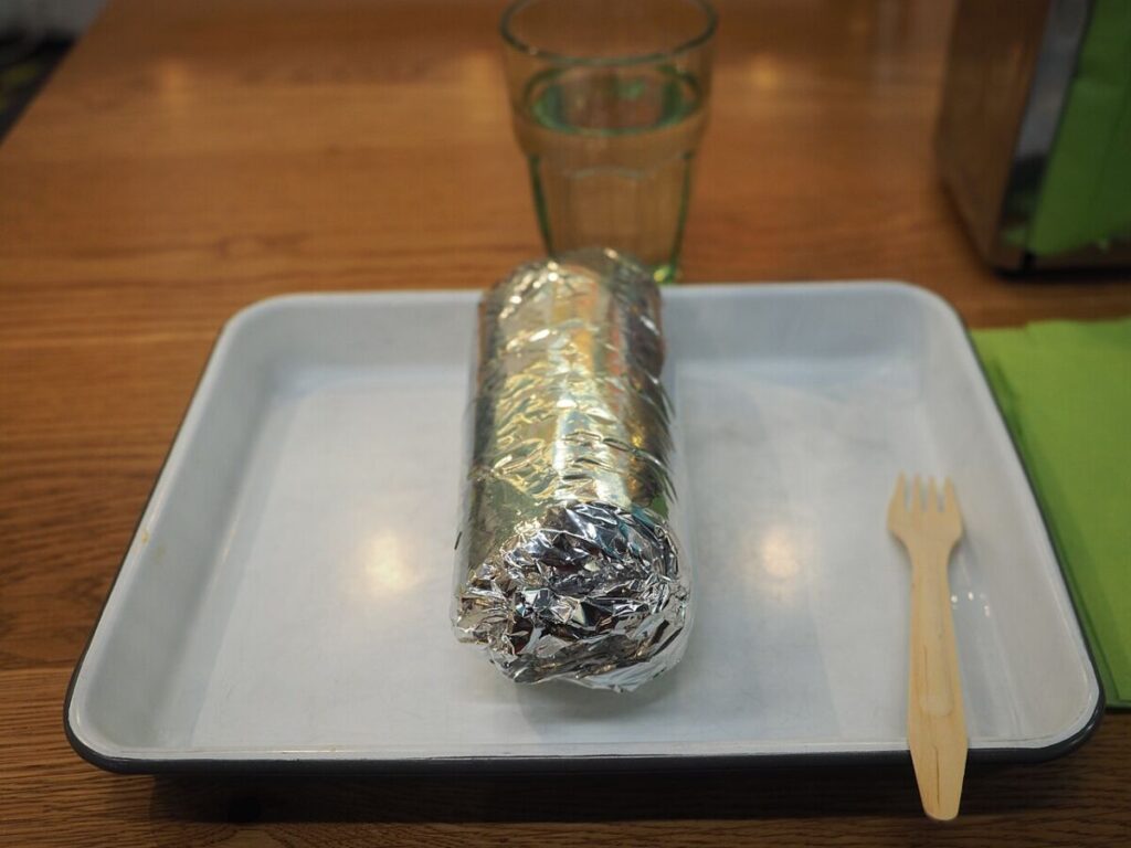 Is Aluminum Foil Recyclable? How to Recycle It Correctly 7 Close-up of a burrito encased in reflective aluminum foil, emphasizing its wrapped form.