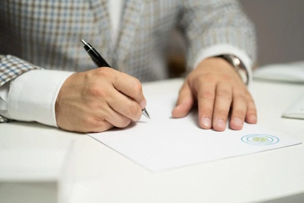 Best Me Mother Earth Products: Eco-Friendly Choices 5 Man signing a certificate
