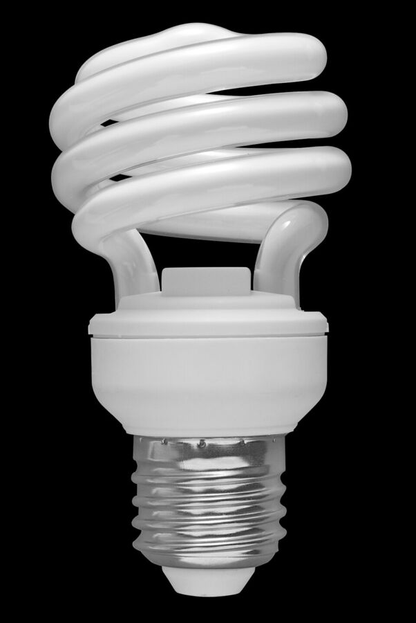 Do Energy-Efficient Light Bulbs Give Off Radiation? 8 Compact fluorescent light bulb with a spiral design, showcasing its white light emission.