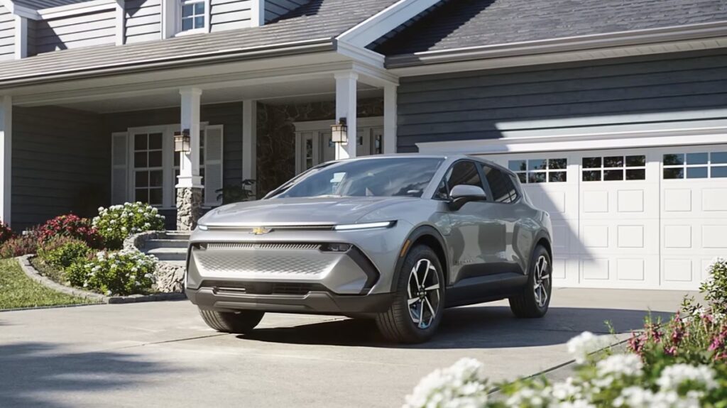 10 Most Eco-Friendly Cars for Different Lifestyles in 2026 9 Chevrolet Equinox EV LT 1 FWD parked in front of a modern house, showcasing its sleek design and vibrant color.