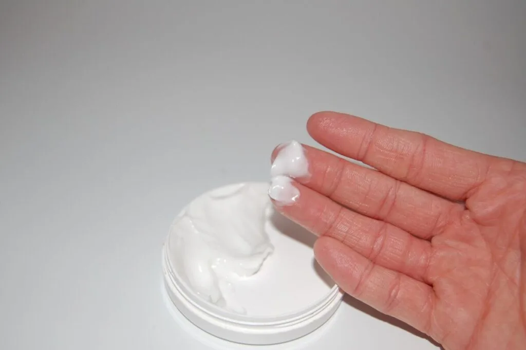Is Jergens Cruelty-Free? Everything You Need to Know 4 Hand with a cosmetic cream