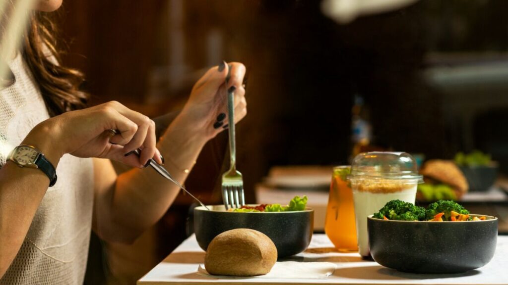 Are Humans Animals? 15 Things to Know 8 Woman eating food with fork and knife