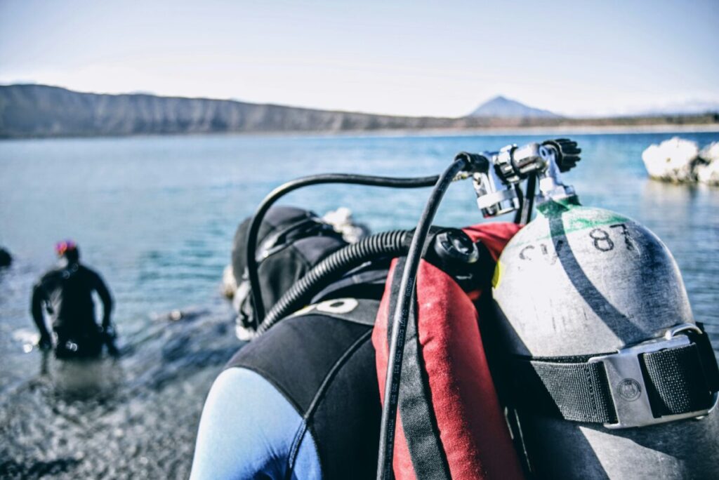 Marine Conservation Diving Tourism Guide 2026 8 Diver recording reef observations on an underwater slate