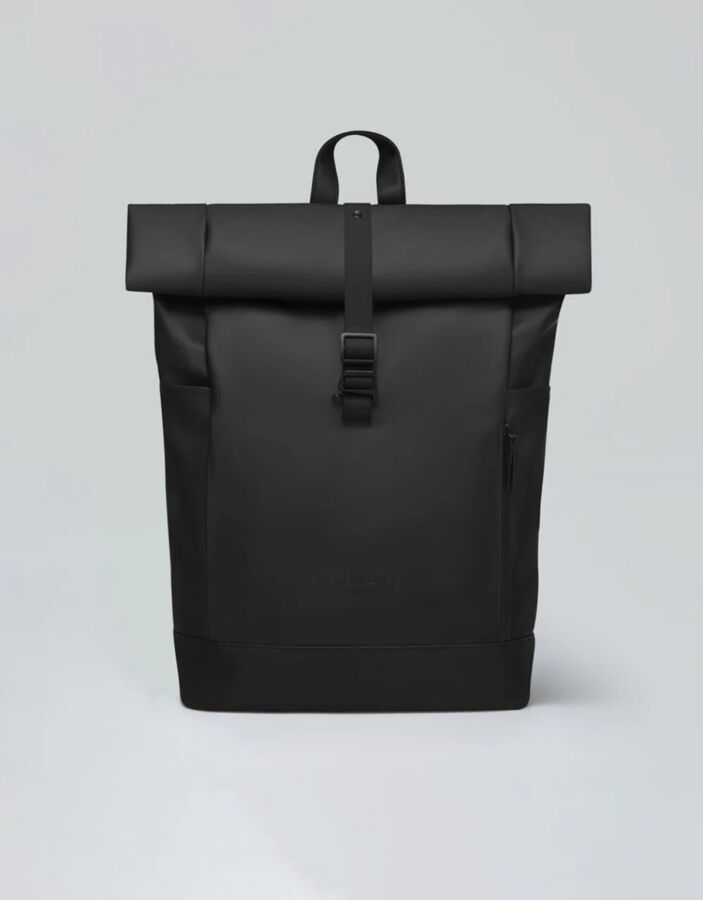25 Best Vegan Backpacks for Work & Travel (2026) 30 Black leather Gaston Luga Spläsh Rolltop 16 backpack featuring a zipper closure and a sleek, modern design.