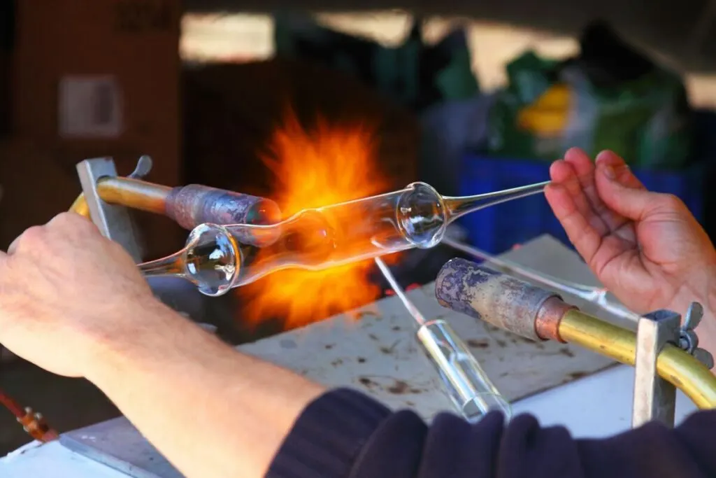 Is Silica Bad for the Environment? 2 Man crafting a glass test tube