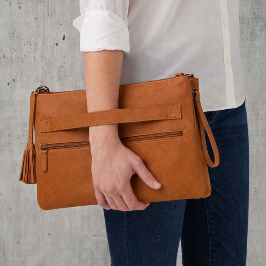 10 Best Fair Trade Handbags for 2026 2 Tan leather Ankita tech bag by SERRV, featuring a sleek design suitable for tech accessories and everyday use.