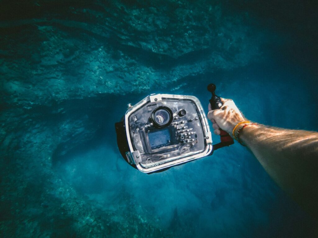 Marine Conservation Diving Tourism Guide 2026 10 Underwater camera operator documenting marine life
