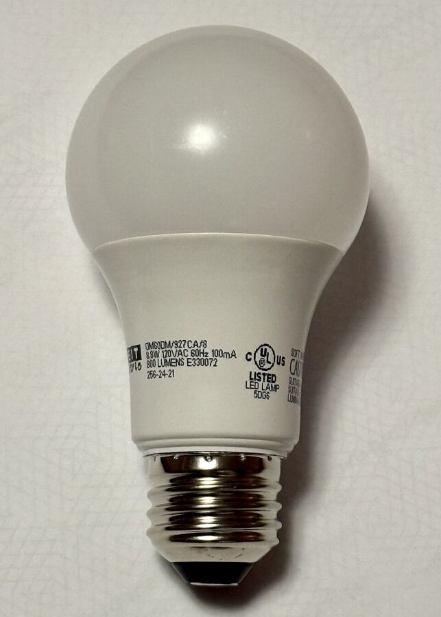 Do Energy-Efficient Light Bulbs Give Off Radiation? 16 White LED light bulb placed on a white surface, showcasing its sleek design and illumination potential.