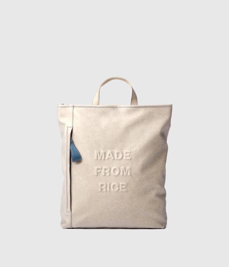 25 Best Vegan Backpacks for Work & Travel (2026) 19 White tote bag with the words "Made from Rice" printed clearly on its surface.