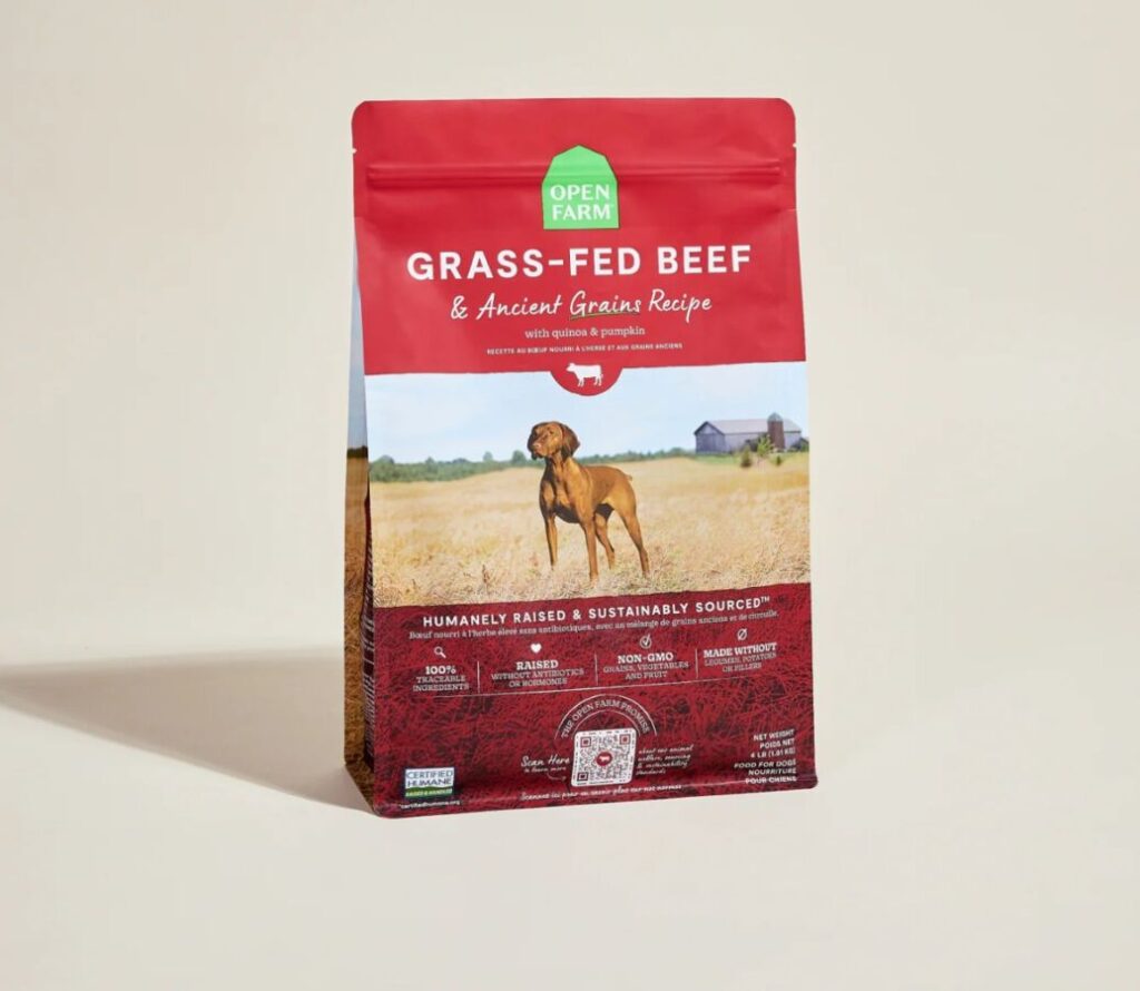 Grass-fed beef dog food package featuring a vibrant design and clear labeling for pet nutrition.
