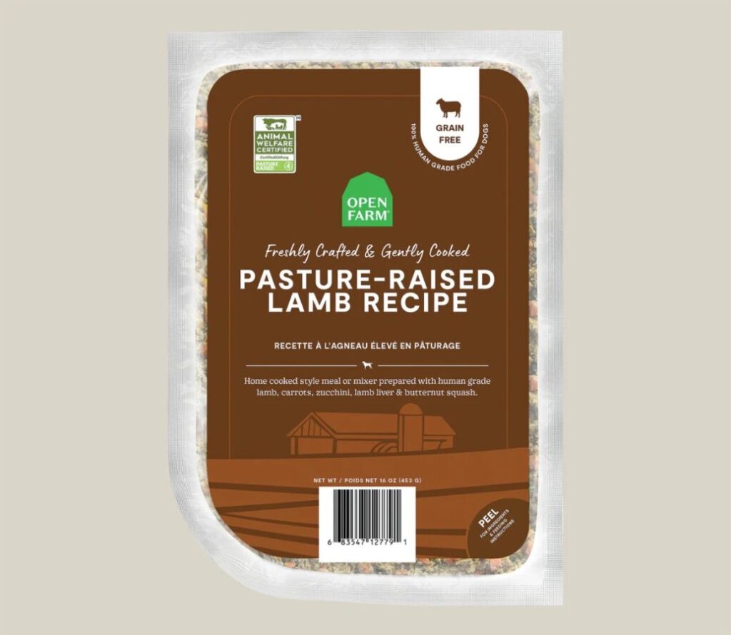 Open Farm Dog Food package displaying a pasteurized lamb recipe, emphasizing natural ingredients for pet nutrition.
