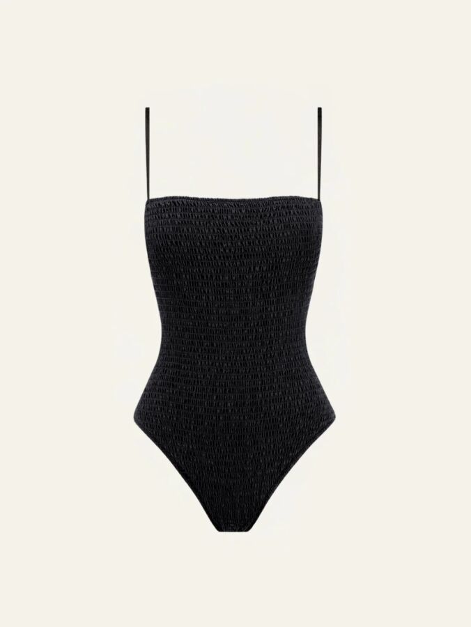 12 Best Sustainable Swimwear Picks for 2026 15 Model showcases a black high-neck one-piece swimsuit, the Peony Shirred design, highlighting its elegant silhouette.