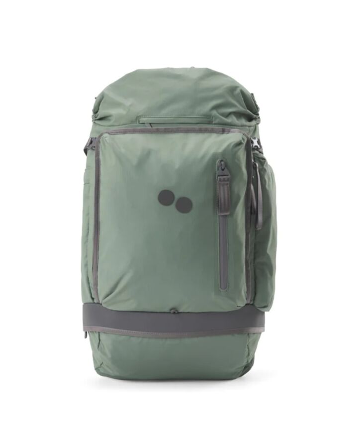 25 Best Vegan Backpacks for Work & Travel (2026) 7 Green pinqponq Komut Medium backpack featuring a prominent black logo on the front.