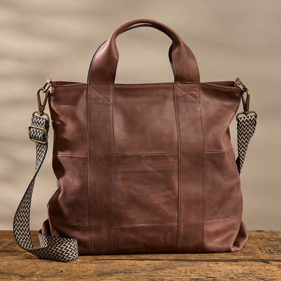 10 Best Fair Trade Handbags for 2026 42 Stylish brown leather tote bag with comfortable straps, ideal for both casual and professional settings.