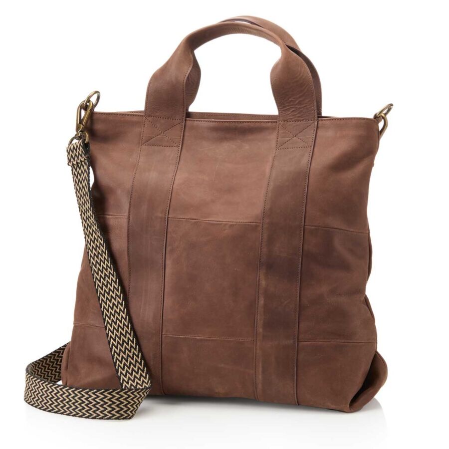 10 Best Fair Trade Handbags for 2026 5 Brown leather tote bag with a strap, showcasing a stylish and durable design suitable for everyday use.