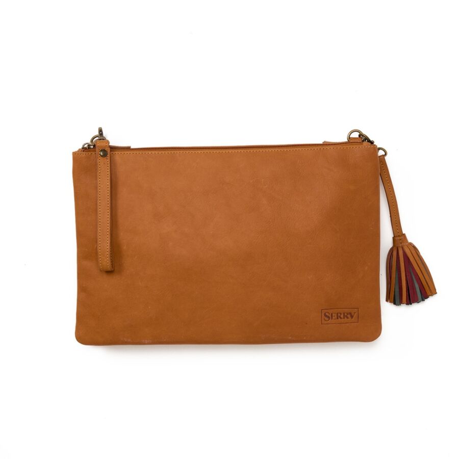 10 Best Fair Trade Handbags for 2026 8 Elegant camel tan leather clutch featuring a decorative tassel, perfect for adding a touch of sophistication to any outfit.