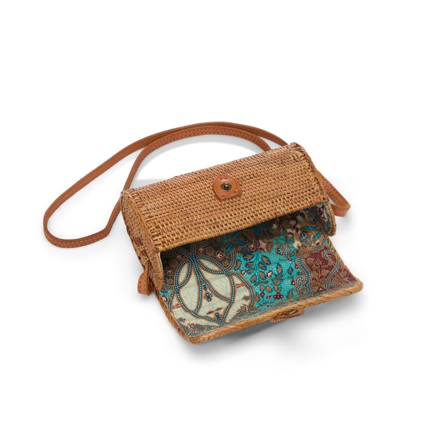 10 Best Fair Trade Handbags for 2026 20 Compact rattan clutch featuring a brown strap, highlighting its woven texture and elegant appearance.