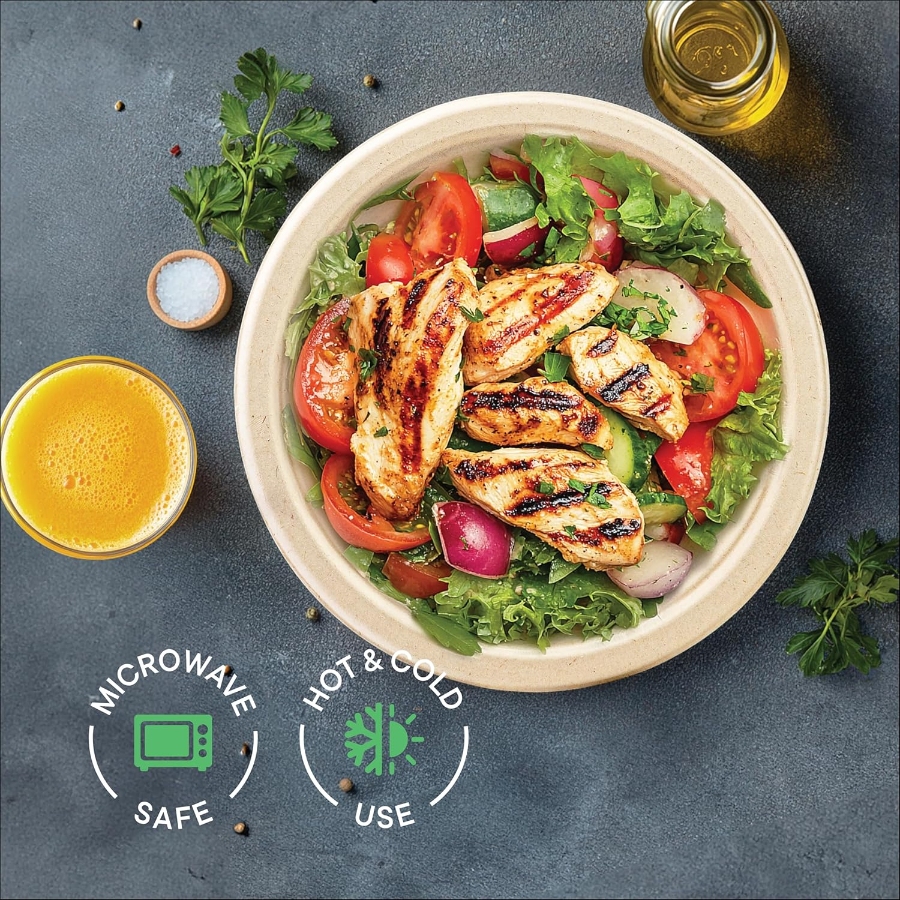 11 Best Compostable Plates for Parties and Everyday Meals 13 Compostable paper plate holds a serving of chicken and vegetables, with a glass of juice beside it.
