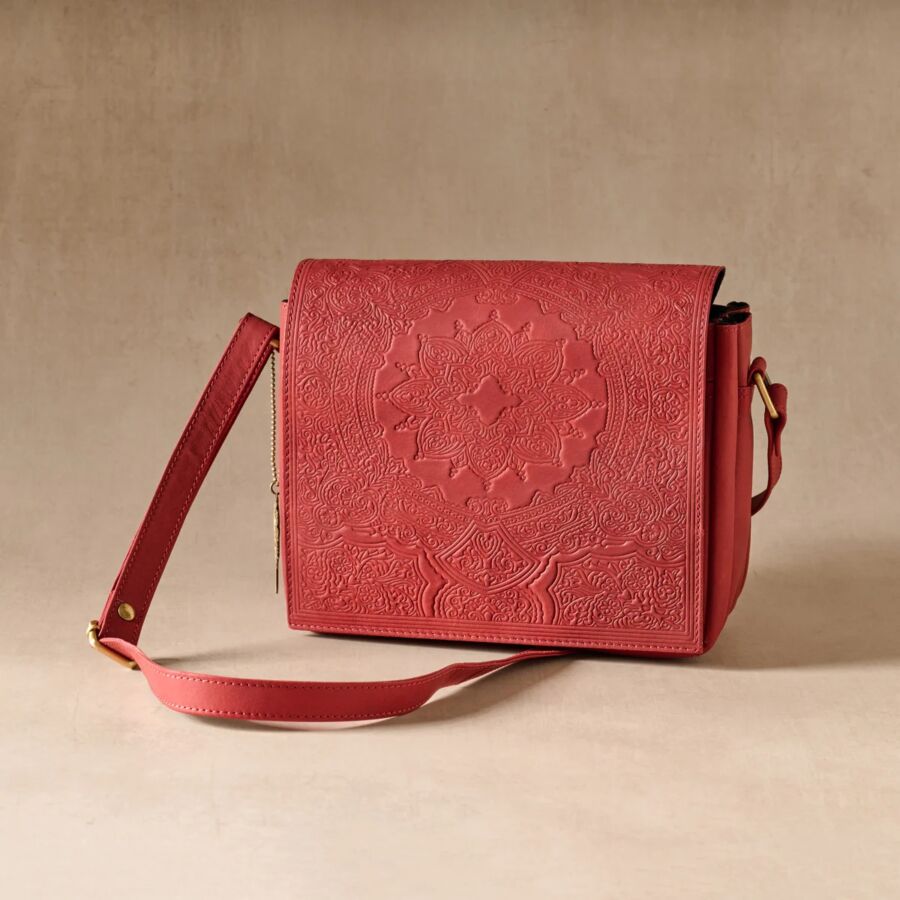 10 Best Fair Trade Handbags for 2026 11 Red leather crossbody bag featuring an intricate embossed design, showcasing craftsmanship and style.