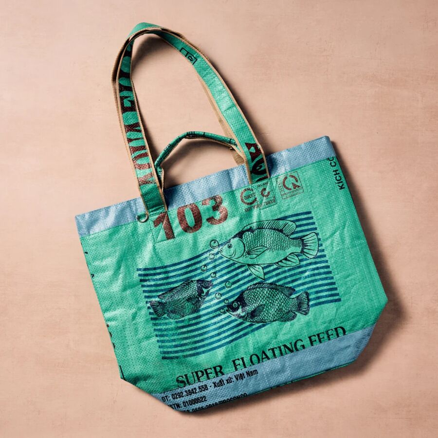 10 Best Fair Trade Handbags for 2026 19 Eco-friendly green tote bag adorned with fish illustrations, created by Ten Thousand Villages from recycled materials.
