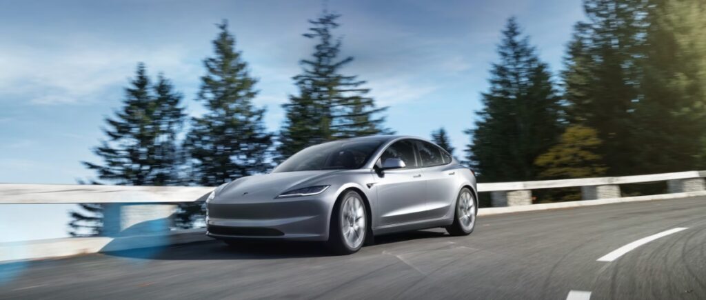 10 Most Eco-Friendly Cars for Different Lifestyles in 2026 17 Tesla Model 3 Standard RWD Drive electric SUV navigating a winding mountain road, showcasing its sleek design and performance capabilities.