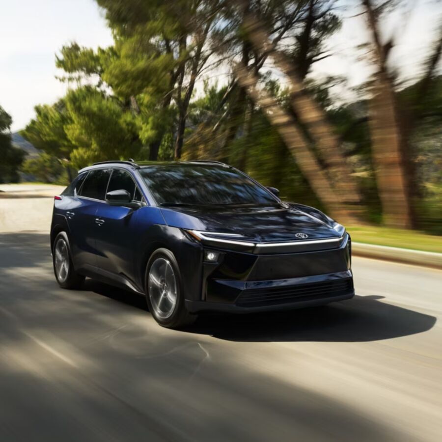 10 Most Eco-Friendly Cars for Different Lifestyles in 2026 4 The Toyota bZ XLE FWD Plus Drive in motion on a road, highlighting its contemporary styling and dynamic performance.