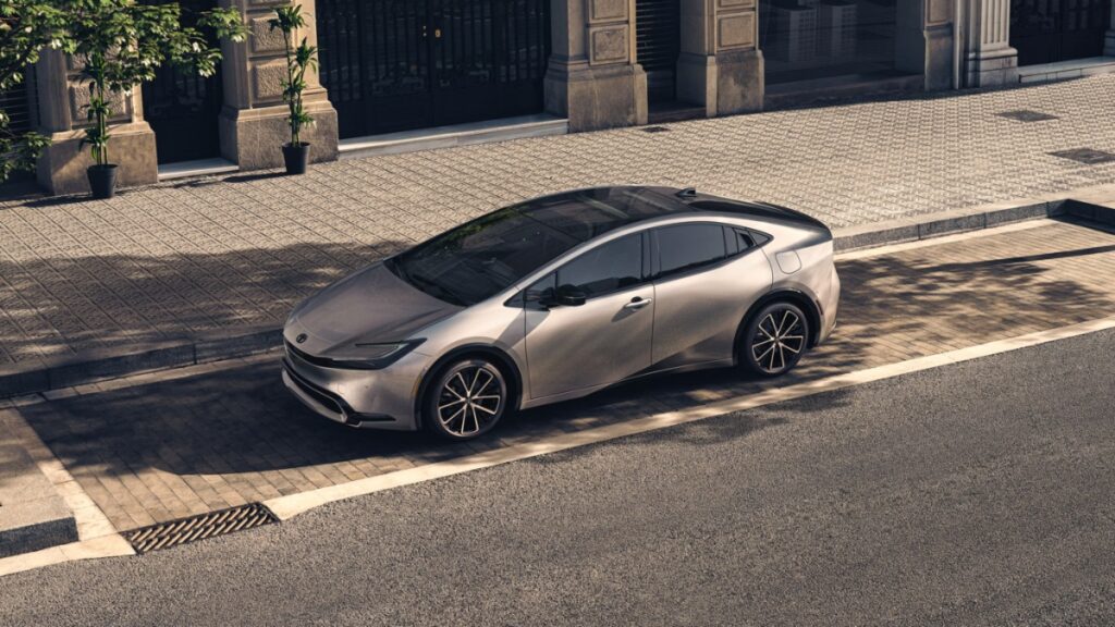 10 Most Eco-Friendly Cars for Different Lifestyles in 2026 21 Toyota Prius LE parked on a city street, showcasing its sleek design and modern features.
