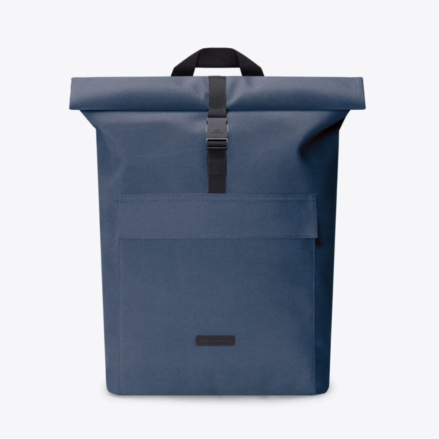 25 Best Vegan Backpacks for Work & Travel (2026) 37 Rolltop backpack in medium dark blue by Ucon Acrobatics, featuring a sleek design and adjustable straps.
