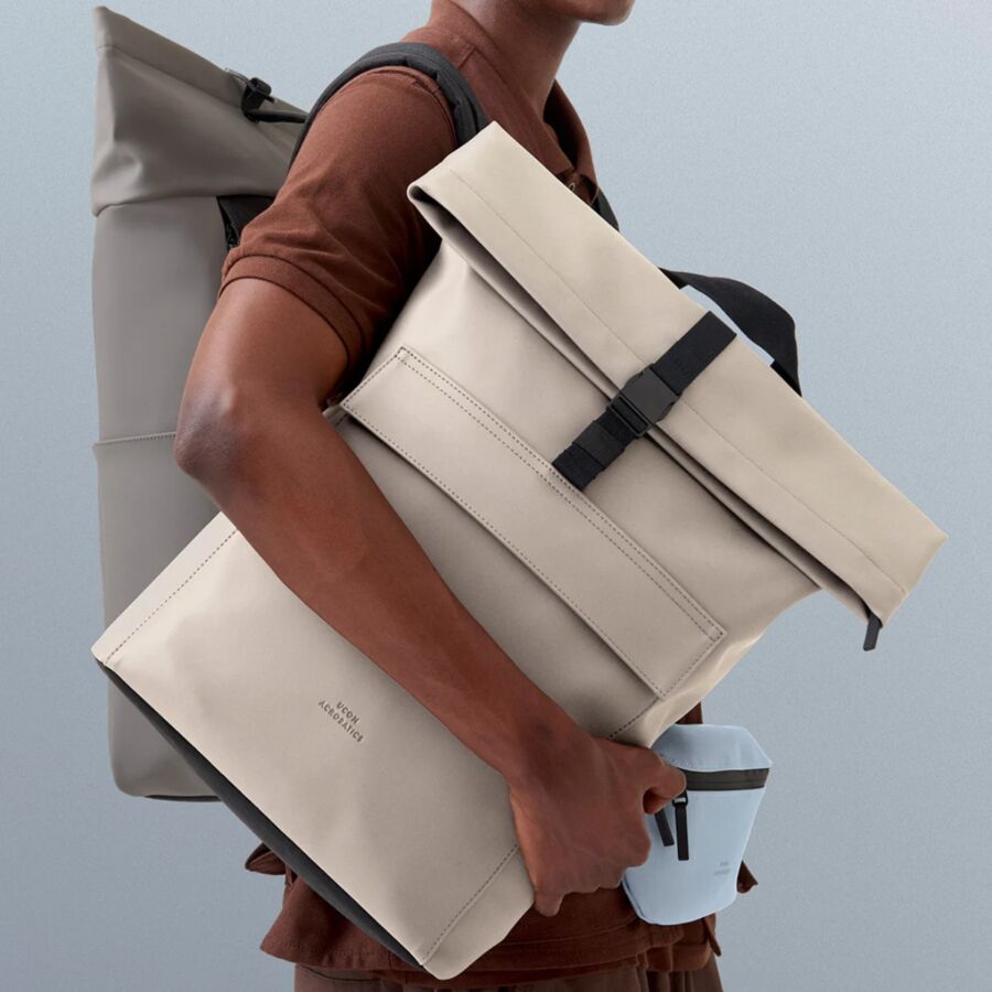 25 Best Vegan Backpacks for Work & Travel (2026) 2 Man wearing a casual outfit carries a two-strapped backpack, showcasing the Ucon Acrobatics Jannik Medium design.