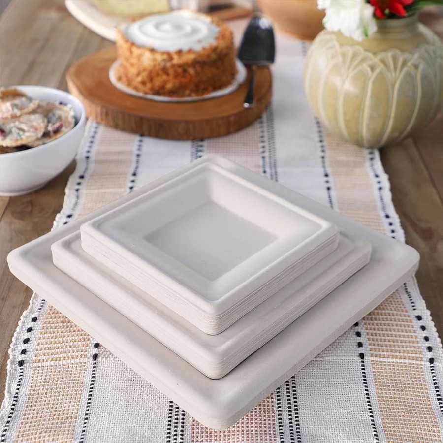 11 Best Compostable Plates for Parties and Everyday Meals 20 Three square fiber plates on a table, with a cake displayed on one of the plates.